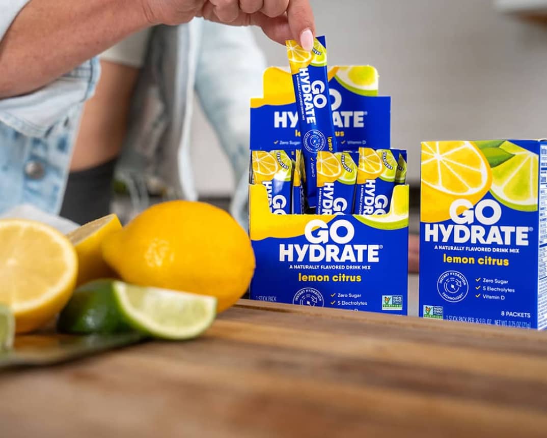 GoHydrate Lemon Citrus - open box with lemons and limes on a wood cutting board